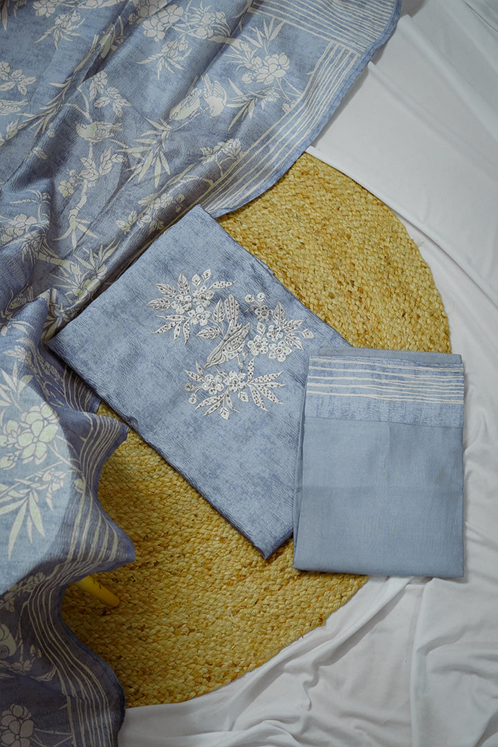 Graceful blue unstitched cotton salwar suit for women with dupatta, featuring delicate floral embroidery and soft textured fabric. Elegant unstitched salwar suit dress material perfect for casual and festive wear. Buy unstitched cotton salwar suits online for a customizable traditional look